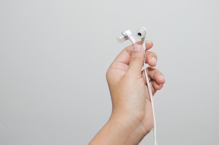 Hand holding earphone.Music and sondの写真素材