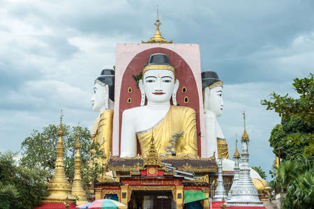 Kyaik-Pun Pagoda, Four towering images of the Buddha sitting back to back, Myanmarの写真素材