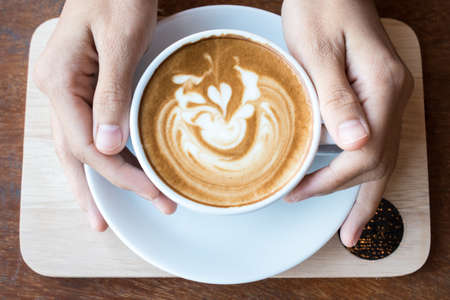 Coffee with latte art on the surface.の写真素材