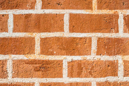 The textured of the brick wall.