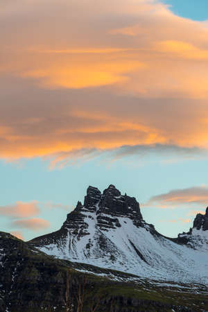 The beautiful mountain and spectacular clouds during the sunset in Stoovarfjorour town of East...