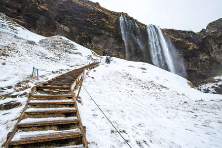 The walk way to go behind the Seljalandsfoss waterfalls in Iceland is one of the most famous nature...