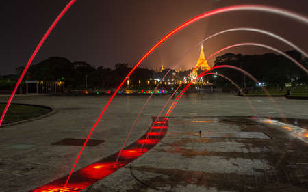 Night view of Shwedagon pagoda an iconic landmark of Yangon township of Myanmar.のeditorial素材