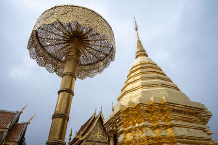 An iconic golden pagoda in Wat Phra That Doi Suthep the most famous iconic Buddhist temple in Chiang Mai province of Thailand.の写真素材