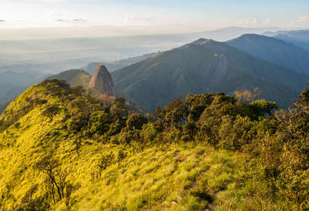 View of Doi Nork at sunset. Doi Nork is iconic huge grey black rock in Doi Luang national park in Phayao province of Thailand. A âNorkâ is mean the large shoulder hump on an Indian cow.の写真素材