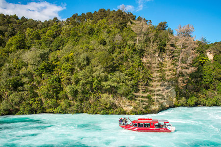 Taupo, New Zealand - April 26 2017: Tourist adventure in Huka Falls with Huka falls river cruise in Taupo, New Zealand.のeditorial素材
