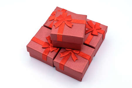 Group of red gift box isolated on white background. Gift or a present is an item given to someone...