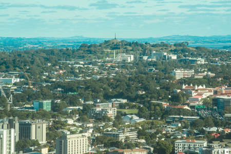 Auckland cityscape with One Tree Hill an iconic volcano of Auckland in the centre, North island of...