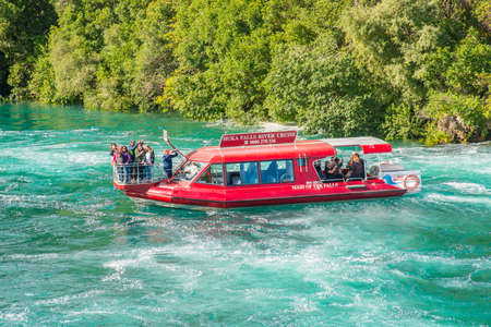 Taupo, New Zealand - April 26 2017: Tourist adventure in Huka Falls with Huka falls river cruise in Taupo, New Zealand.のeditorial素材