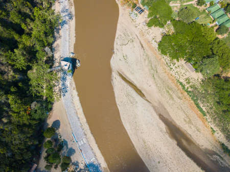 Aerial view of dry river of Kok river in hot season nearly Chiang Rai beach, a river bank with rocky...