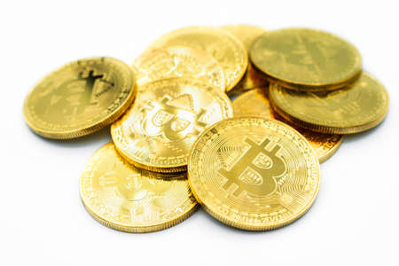 Stack of golden Bitcoin isolated on white background. Bitcoin is one of the popular cryptocurrency (a digital assets) , it's the innovative payment network and a new kind of money.の写真素材