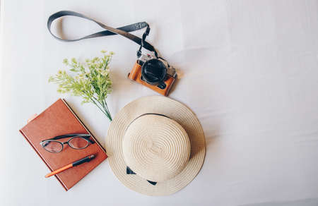 The set of travel equipment arrangement on the bed, prepare for travel. Abstract of travel and holiday background.の写真素材