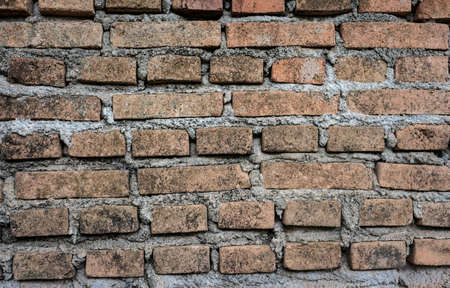 An old brick wall textured and pattern for background usage as a backdrop design.の写真素材