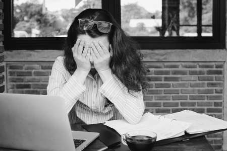 Portrait of beautiful businesswoman stressed from work. anxiety in adult cause to depression and a problem in living that drag you down to feeling sadness,lonely and worried.の写真素材