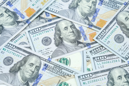 Pile of One hundred dollars banknotes pattern. The official currency of the United States of...