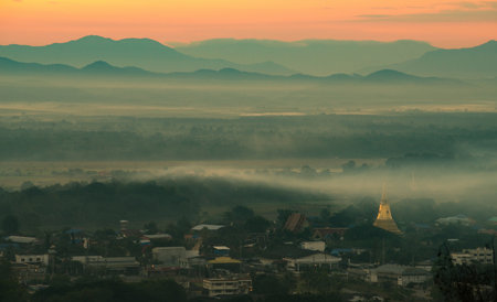 Sea of fog covered Nan town in the morning. Nan is a charming town in northern Thailand located in a province with the same name.の写真素材