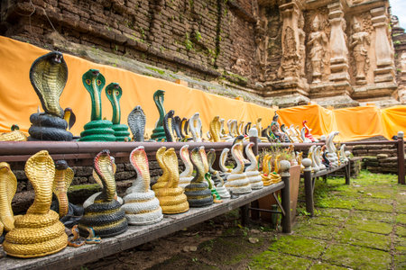 A lot of snake statue around the base of pagoda in Wat Jed Yod temple of Chiang Mai province of...