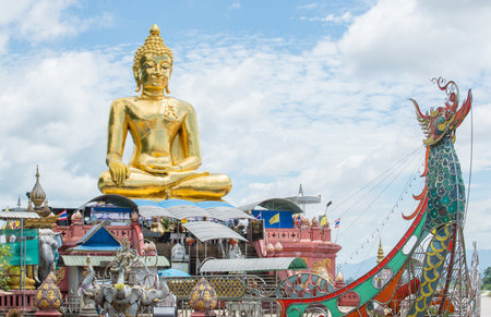 Big golden Buddha statue with Lanna style located at Golden triangle the area where the borders of Thailand, Laos, and Myanmar meet at Mekong rivers. Chiang Rai province of Thailanの写真素材