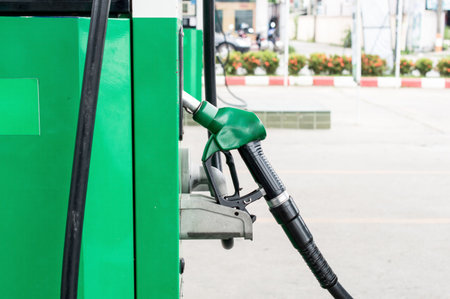 Green petrol pump in gas station. Gas station in a service.の写真素材