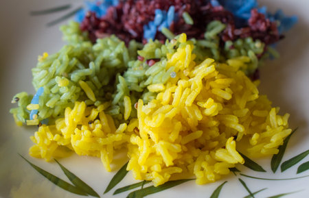 Close-up of colourful cooked rice served in plate. Fusion food style.の写真素材