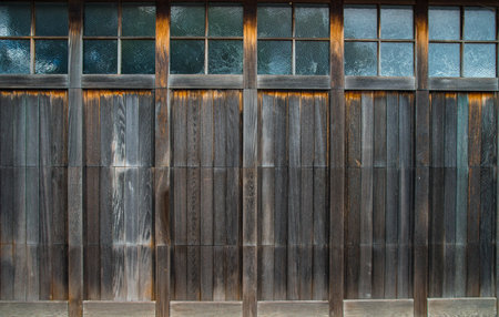 Old wooden wall with stained glass window.の写真素材
