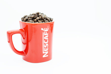 CHIANG RAI, THAILAND- August-04-2017 : A red mug of Nescafe on isolated white background.のeditorial素材