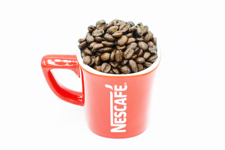 CHIANG RAI, THAILAND- August-04-2017 : A red mug of Nescafe on isolated white background.のeditorial素材