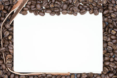 A book open the empty page with frame coffee beans background.の写真素材
