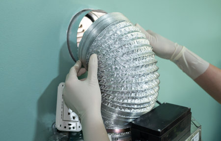 Someone trying to change an old aluminum foil of ducting pipe. Aluminium ducting is normally used...
