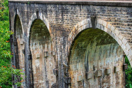 View of Nine Arch Bridge a very picturesque spot in Ella, Sri Lanka. Ella is a mountain town in the Central Highland of Sri Lanka surrounded by the beautiful greens of tea plantatiの写真素材