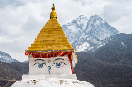 Ancient Tibetan Buddhist stupa with beautiful view of Mt.Ama Dablam located in Dingboche village Nepal.の写真素材