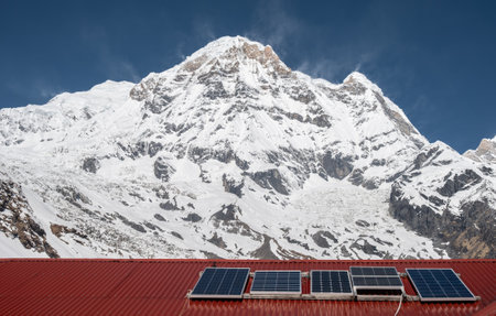 Mt. Annapurna South (7,219 m) seen from lodges in Annapurna base camp, Nepal. The Annapurna Base Camp is a small cluster of lodges opposite the Annapurna glacier.の写真素材