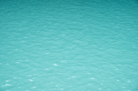 Turquoise water from limestone waterfall. Iron, manganese, and calcium carbonate from limestone are all common minerals that can cause water to range in color from red and orange tの写真素材