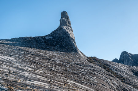 Granite plateau on Mt.Kinabalu with an iconic Donkey's Ear Peak. Mt Kinabalu is one of the highest mountain in South East Asia.の写真素材
