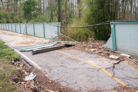 The wall and road collapse due to an earthquake in Chiang Rai province of Thailand. Earthquake causes the building to move with greater amplitude until some part of the building coの写真素材