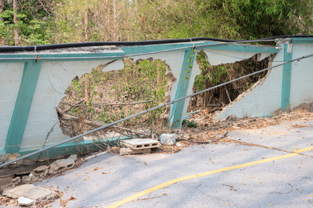 The wall and road collapse due to an earthquake in Chiang Rai province of Thailand. Earthquake causes the building to move with greater amplitude until some part of the building coの写真素材