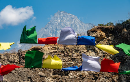 Mt.Khumbila (5,761 m) look through prayer flags. The name is translated as "God of Khumbu" in the Khumbu region of Eastern Nepal. The mountain is considered home to the patron Godの写真素材