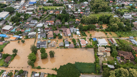 Aerial view of suburb area in Chiang Rai province flooding by Kok river after typhoon Yagi has swept Southeast Asia.の写真素材