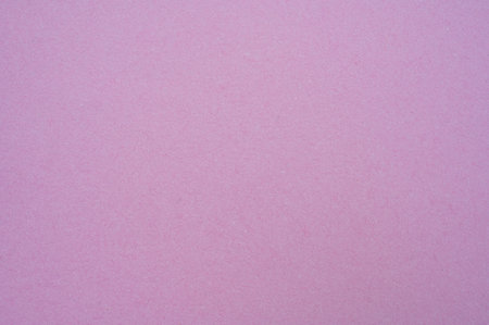 Full frame shot of pink paper sheet texture and background. Colored paper or construction paper, is a type of paper that comes in a wide range of colors.の写真素材