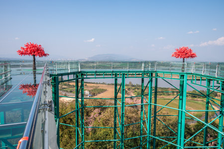 Scenery view of skywalk in Wat Phrathat Pha Ngao temple for viewing Thailand and Laos border across Mekong river.の写真素材