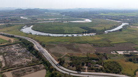 Aerial view of Mae Kok river the major river in Chiang Rai and its waters originate from the mountains at Burma flowing through the province and draining in Mae Kong River.の写真素材