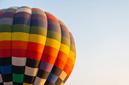 Cropped shot view of hot air balloon envelope against the sky. The envelope is the part of the hot...