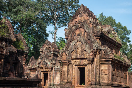Buildings in Banteay Srei a 10th century Cambodian temple dedicated to the Hindu god Shiva made by pink and red sandstone in Siem Reap, Cambodia.の写真素材