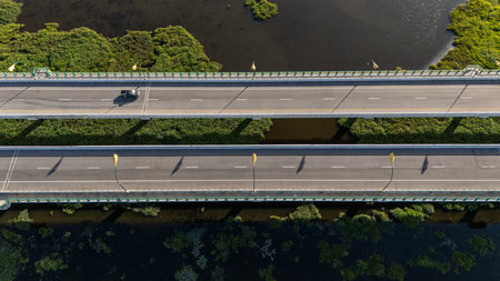 High angle view of a car driving on the bridge for crossing Nong Luang the largest lake in Chiang...