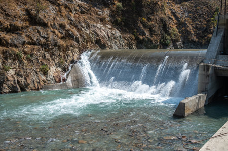 Langtang Khola hydroelectric small dam in Langtang national park, Nepal. The purpose of producing hydroelectric power, dams are created to control river flow and regulate flooding.の写真素材