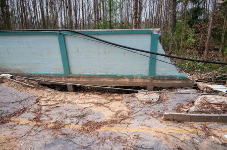 The wall and road collapse due to an earthquake in Chiang Rai province of Thailand. Earthquake causes the building to move with greater amplitude until some part of the building coの写真素材