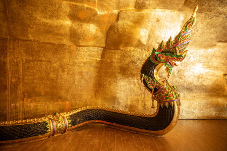 Naga statue situated in a cave at Wat Ahong Silawat temple in Bueng Kan province, Thailand. A naga statue is mythical creature that symbolizes protection, water in Southeast Asianの写真素材