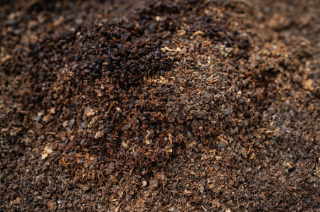 Full frame shot of used coffee grounds. Coffee grounds have many practical uses around the home and garden and can even help spruce up your beauty routine.の写真素材