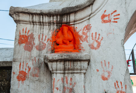 Ganesha sculpture applied by Sindoor (vermillion) situated in Pashupatinath temple in Kathmandu, Nepal. Sindoor is applied to sculptures for religious and symbolic reasons.の写真素材