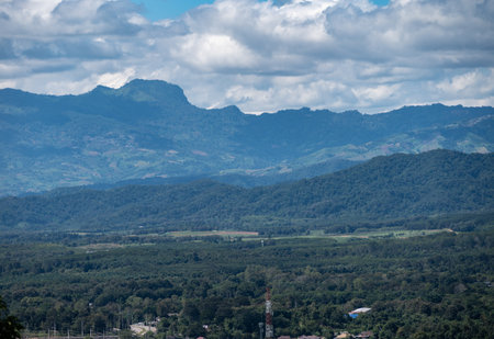 Doi Chang mountain seen from Wat Phra That Doi Khao Kwai temple in Chiang Rai province of Thailand. This mountain famous for being a prime location for high-quality Arabica coffeeの写真素材